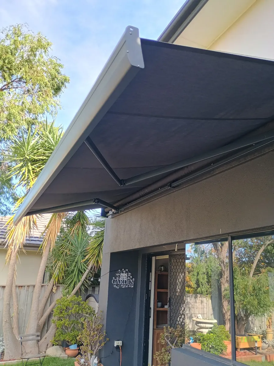 Folding arm awning over an outdoor garden patio, Melbourne