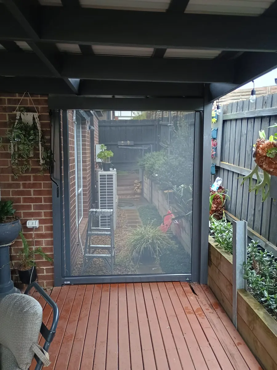 Ziptrak outdoor screen shading a decked pergola, Melbourne
