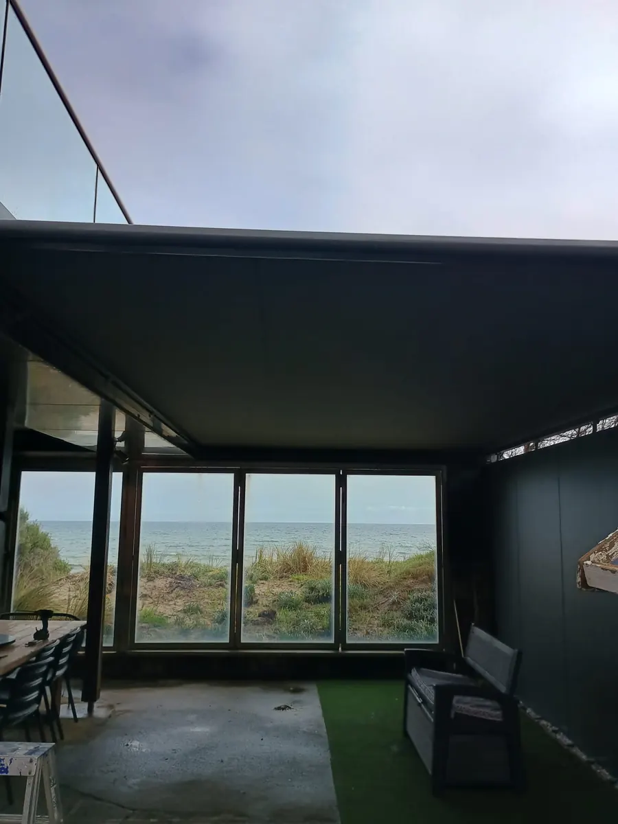 Straight-drop awning over a beachfront outdoor room